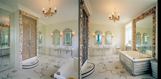 Two views of a pale bathroom with paired basins, decorative mirrors and shell motifs across the floor and door surrounds.